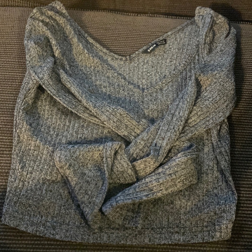 A long sleeve top it’s in good guilty and cute to wear out in the spring!